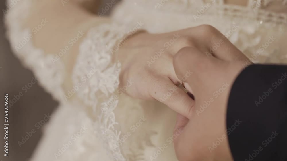 Newly married couple holding hands. Wedding flowers. Close-up. Newly married couple holding hands. Wedding flowers. Close-up.