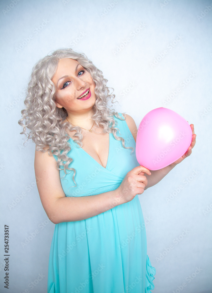 pretty blonde cheerful girl with pink air balloon on white studio background pretty blonde cheerful girl with pink air balloon on white studio background