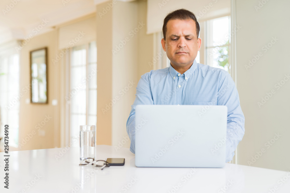 Middle age man using computer laptop Middle age man using computer laptop