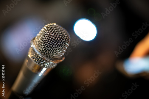 microphone on a stage audio recording song sing theme recording equipment receiver accent tonality character condenser karaoka sing radio enterteinment