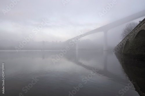 Misty Douro river bridge