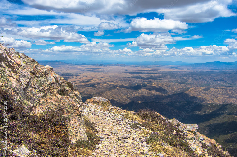 Rocky hiking path on a mountain side with beautiful view.