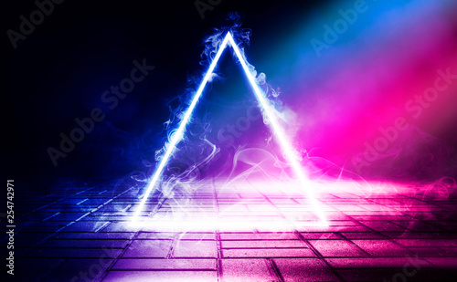 Neon triangle shape in smoke on a dark background. Background of empty room with concrete floor, neon light