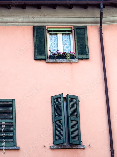 pink wall of medieval house in Lecco town