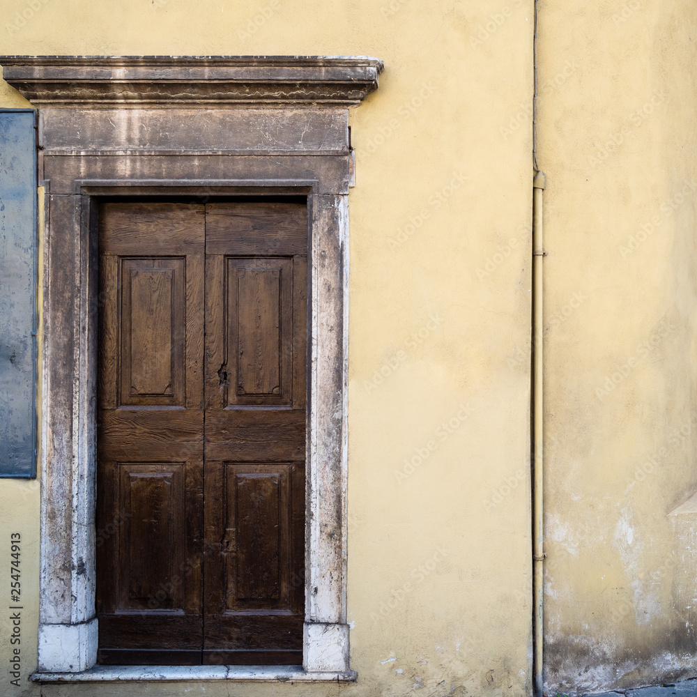 wooden door of medieval house in Brescia city wooden door of medieval house in Brescia city
