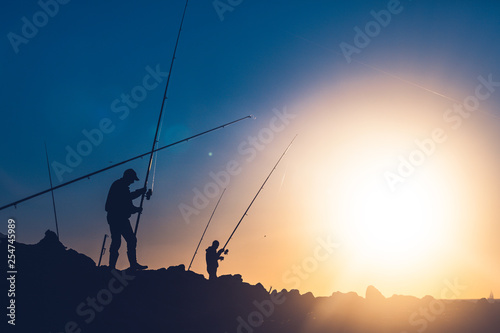 Fisherman fishing during hot summer day © mehdivir