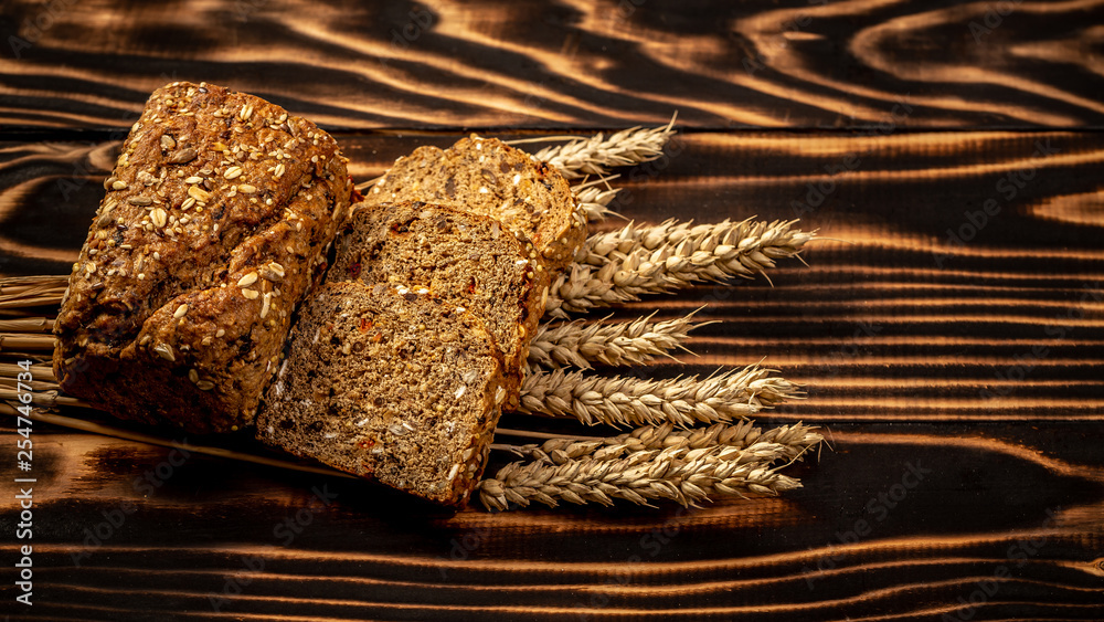 Obraz premium Gluten free food. Various bread with seeds of goji berry on wooden background from top view. Healthy and diet concept