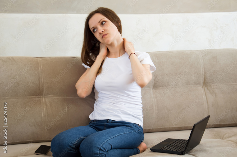 The girl worked at the computer and her neck ached. Pain in the neck. The girl worked at the computer and her neck ached. Pain in the neck.