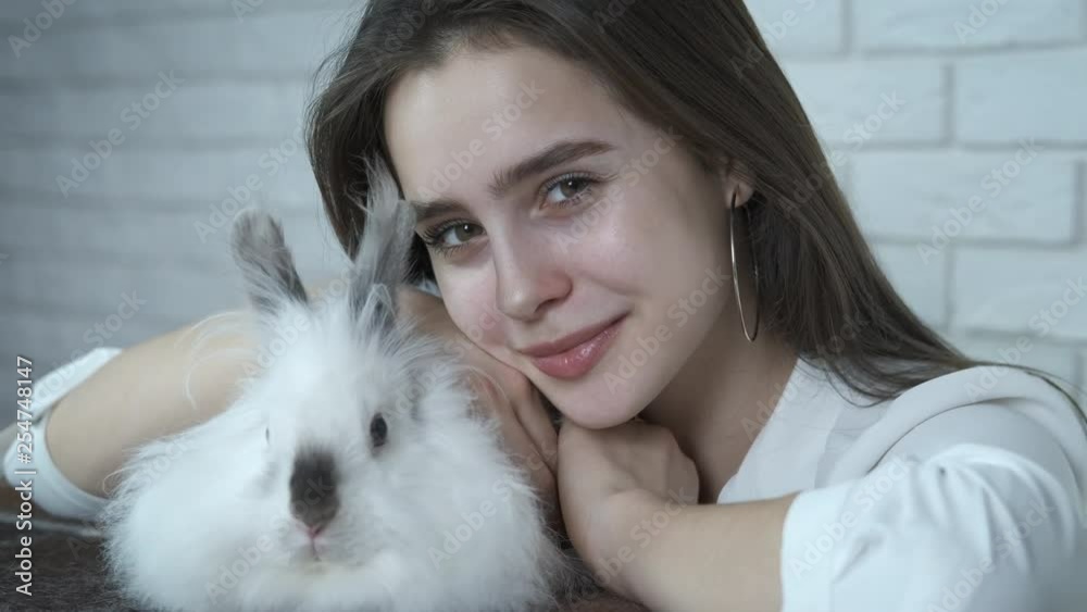 Girl with Easter bunny. Adorable girl with a fluffy white rabbit. Girl with Easter bunny. Adorable girl with a fluffy white rabbit.