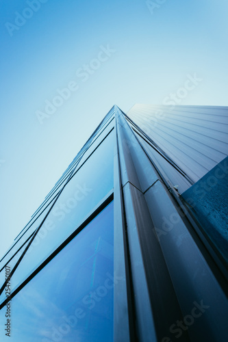 Modern skyscraper out of glass and blue sky