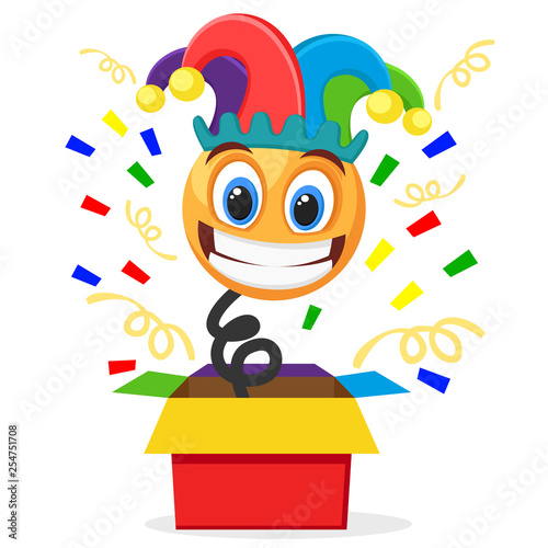 Cheerful smiley in a clown hat jumped out of the box on a white. April fool s day