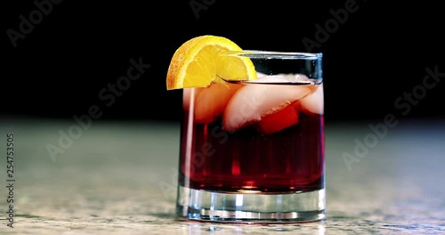 Mixed cocktail sliding on bar photo
