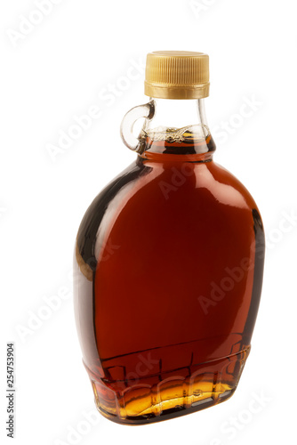 Decorative traditional maple syrup bottle from Canada. Isolated on white background.