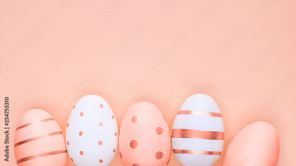 Many easter eggs on trendy pastel background. Eggs are hand-drawn. Flat lay style. Copyspace for text. Minimalism concept. Happy Easter. Color of the Year 2019.