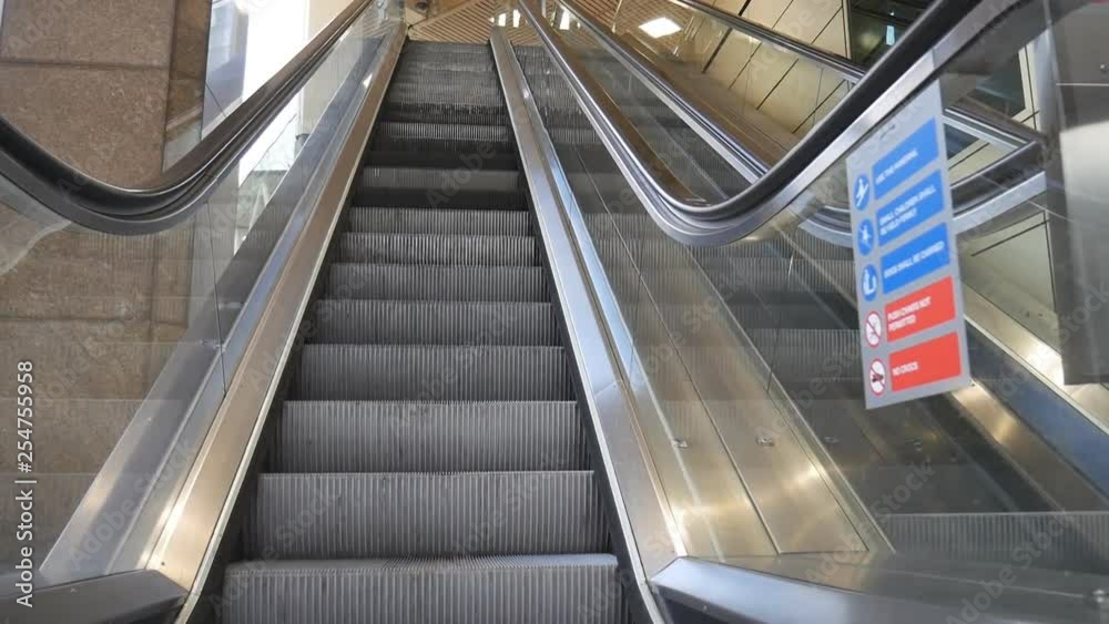 An escalator in the station going up.