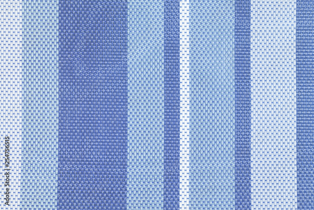 Texture of large weaving close up. Background with light and dark blue stripes. Textile. Photo for layouts. Texture of large weaving close up. Background with light and dark blue stripes. Textile. Photo for layouts.