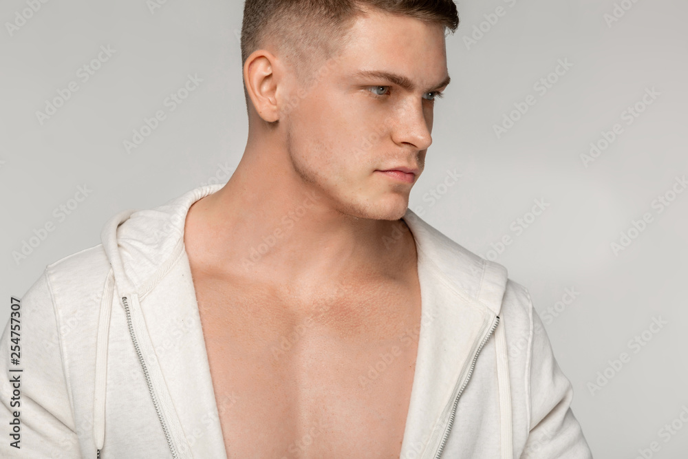 Fototapeta premium Close up portrait of young muscular man with short haircut