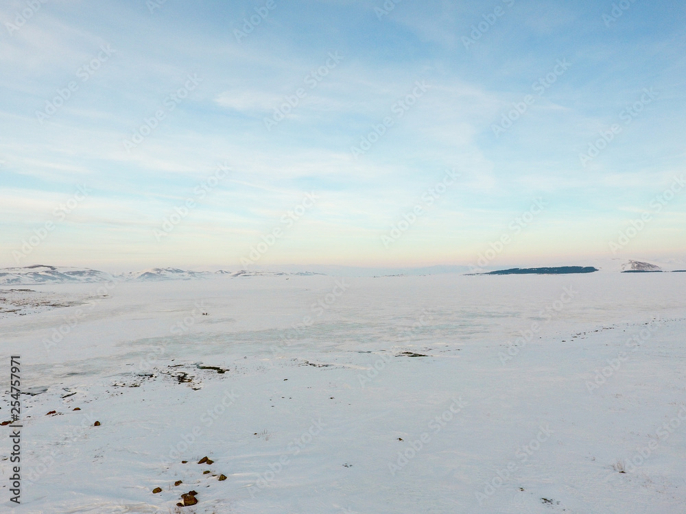 Winter landscape,frozen lake on a clear winter day. Winter landscape,frozen lake on a clear winter day.