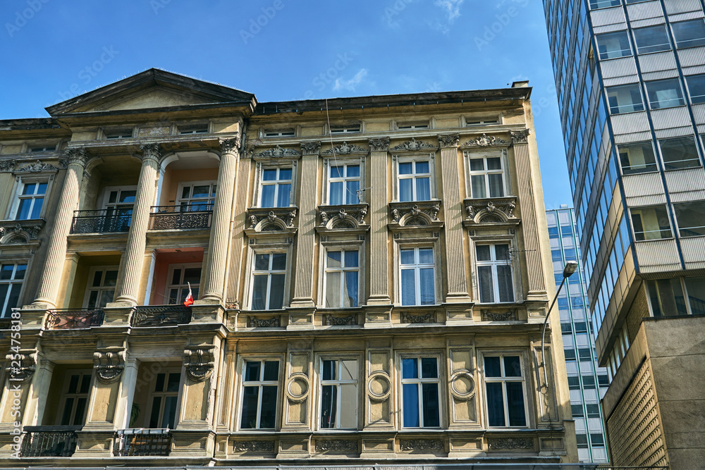 Art Nouveau facade of the building  and fragment of modern office buildings in Poznan...
