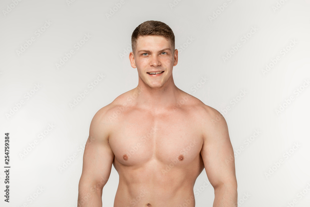 Half length portrait of shirtless muscular healthy man