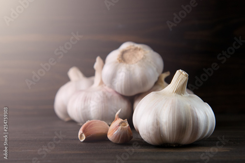 Garlic bulb on the wooden vintage background