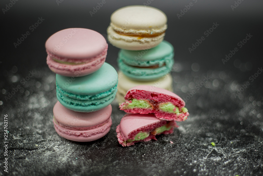 colored macaroons on a black background colored macaroons on a black background