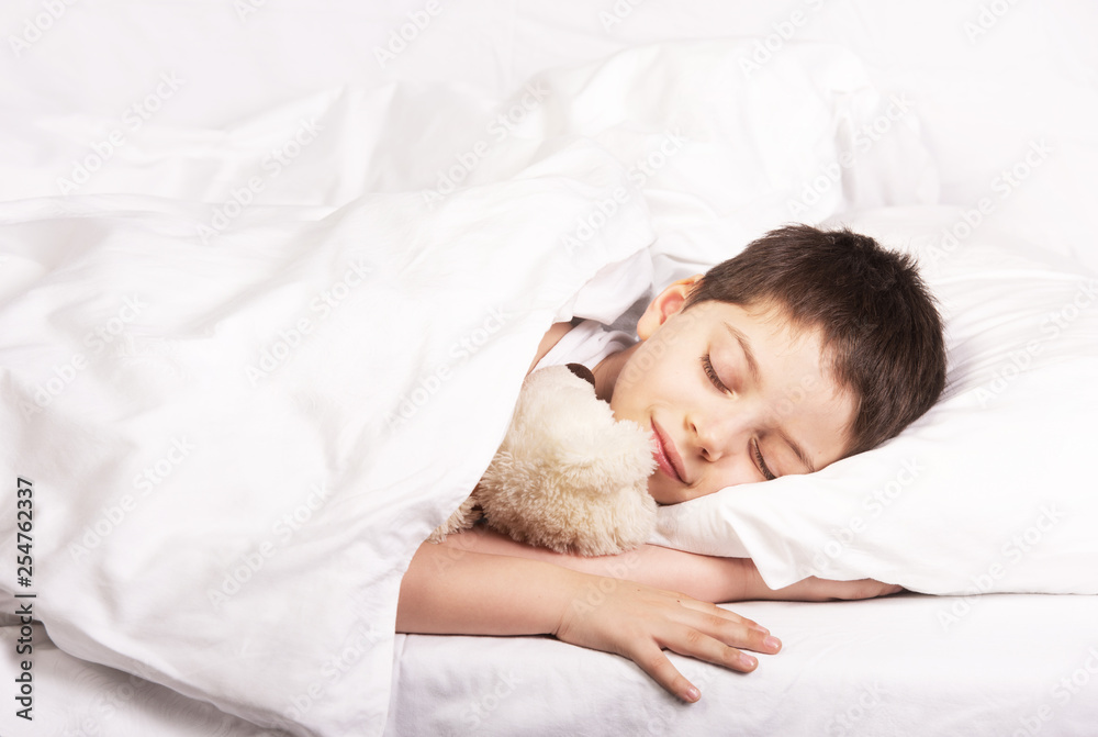 Cute little boy is sleeping with his toy Cute little boy is sleeping with his toy