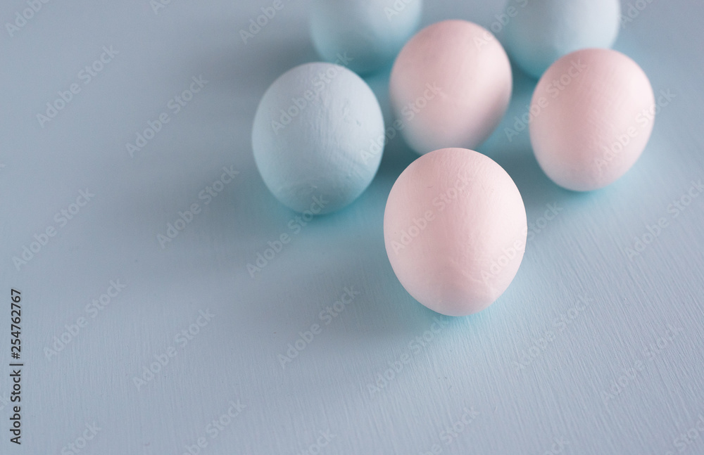 Spring and Easter holiday concept. Easter eggs painted blue and white, pastel color background. Isolated on white. Spring and Easter holiday concept. Easter eggs painted blue and white, pastel color background. Isolated on white.