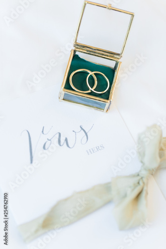 Wedding bands and printed vows