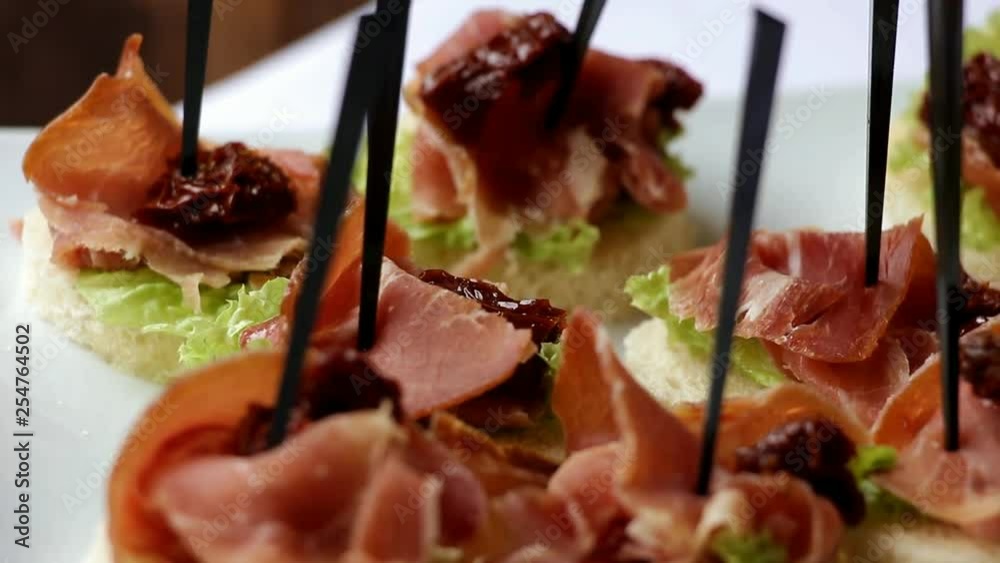 canape with juicy pieces of meat and lettuce, close plan canape with juicy pieces of meat and lettuce, close plan
