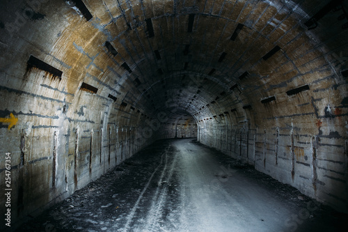 Long underground tunnel or corridor in abandoned Soviet military bunker 