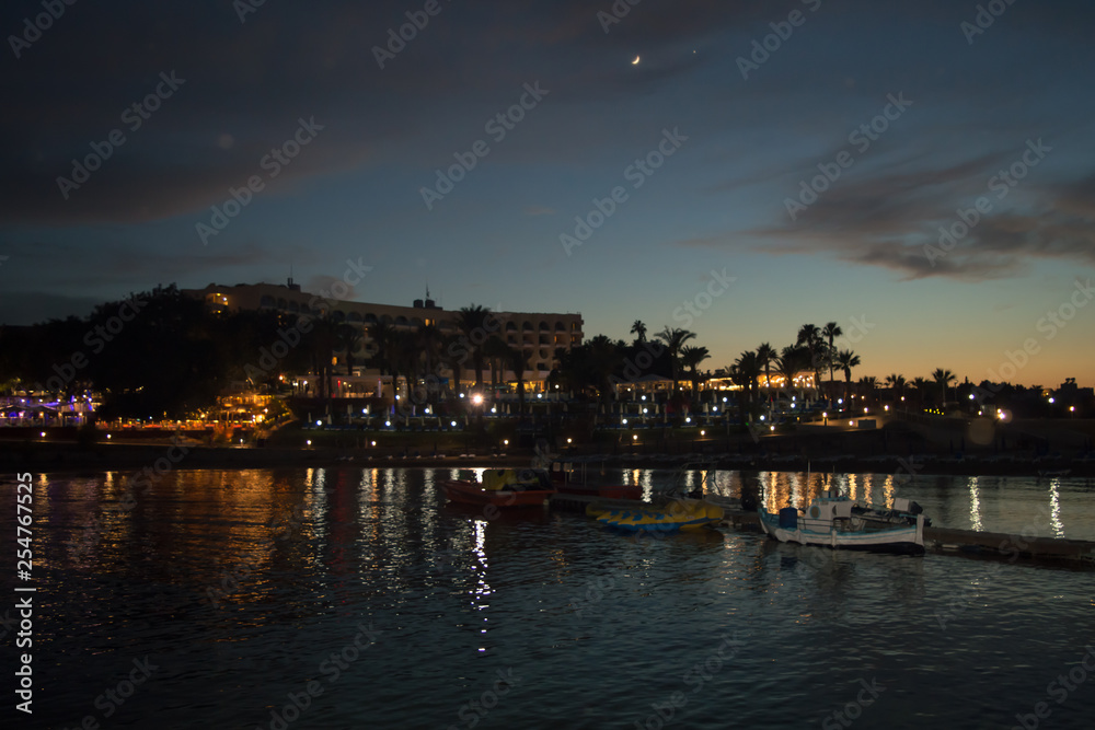  Night walking along wharf near Louma Beach at in Pernera, Cyprus on June 16, 2018. 