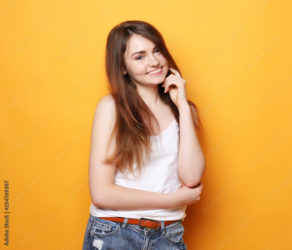 Beautiful happy girl touches her hair. Beautiful happy girl touches her hair.