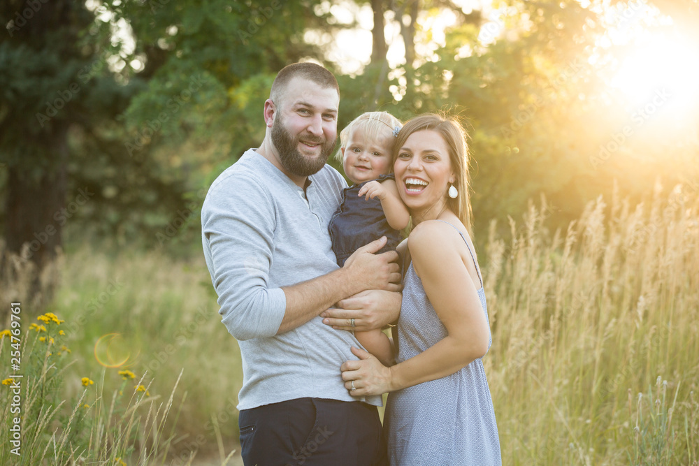 Young beautiful family laughing in summer Young beautiful family laughing in summer