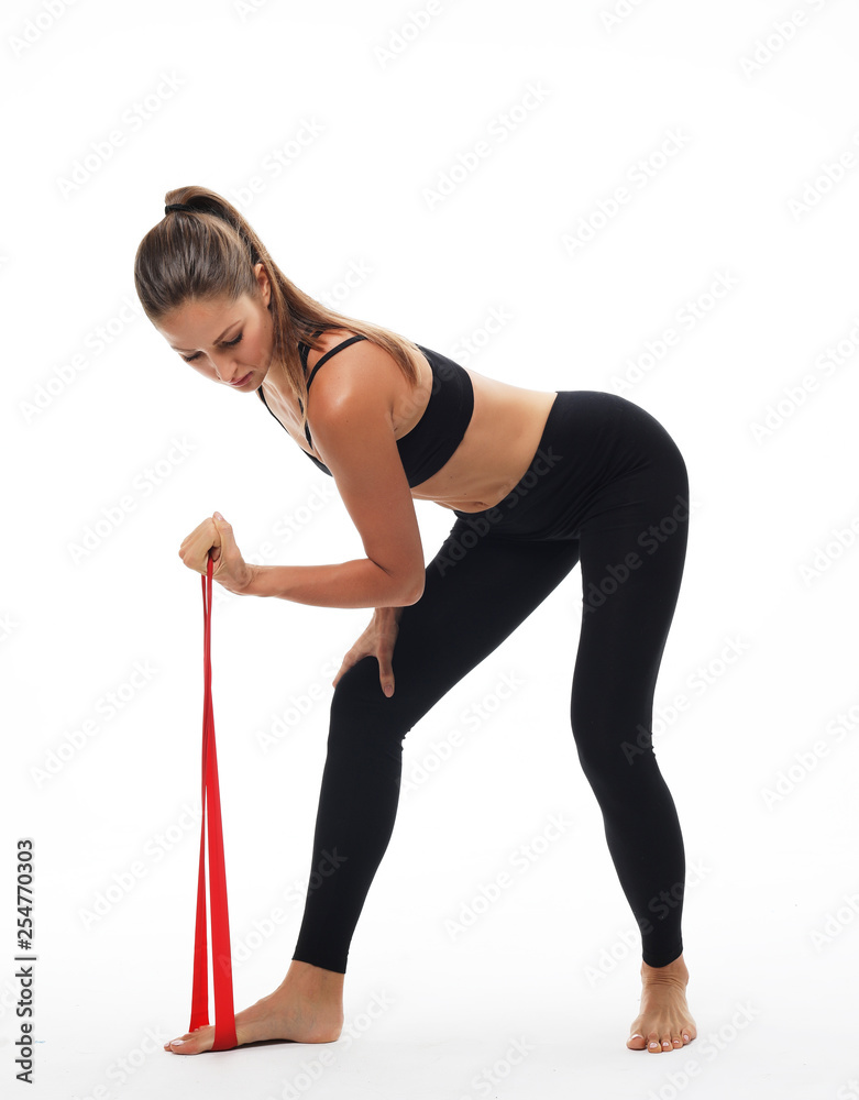 Sporty woman doing a exersize with resistance band. Sporty woman doing a exersize with resistance band.