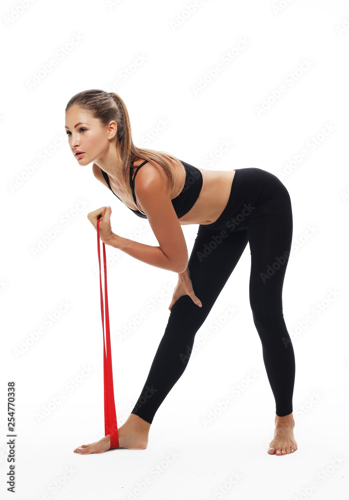 Sporty woman doing a exersize with resistance band. Sporty woman doing a exersize with resistance band.