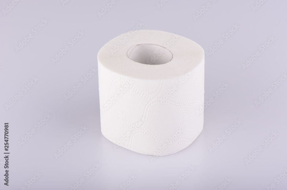 A roll of white toilet paper isolated. The paper product used in the sanitary and hygienic purposes. A roll of white toilet paper isolated. The paper product used in the sanitary and hygienic purposes.