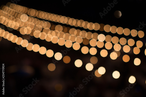 Fotografia, Obraz Strung lights on black background