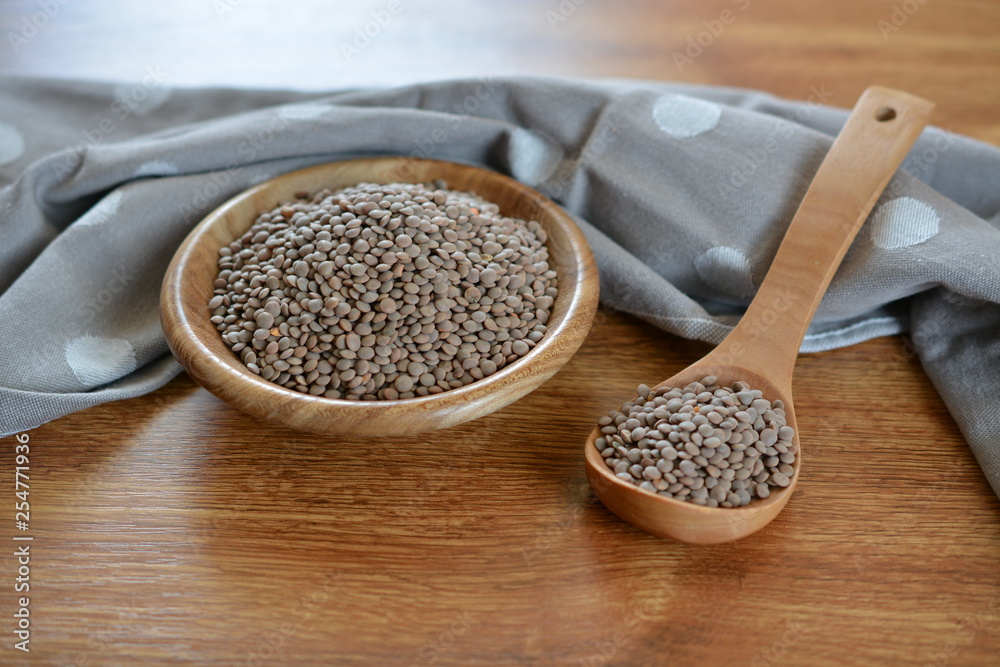 raw gray lentils in a bowl raw gray lentils in a bowl
