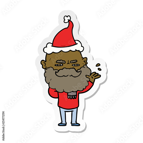 sticker cartoon of a dismissive man with beard frowning wearing santa hat