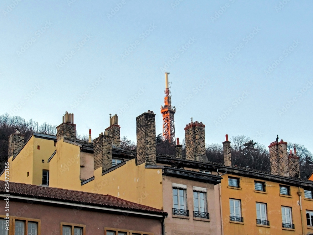 Metallic tower of Fourviere, steel framework tower with rooftops and chimneys, Lyon, France, Europe