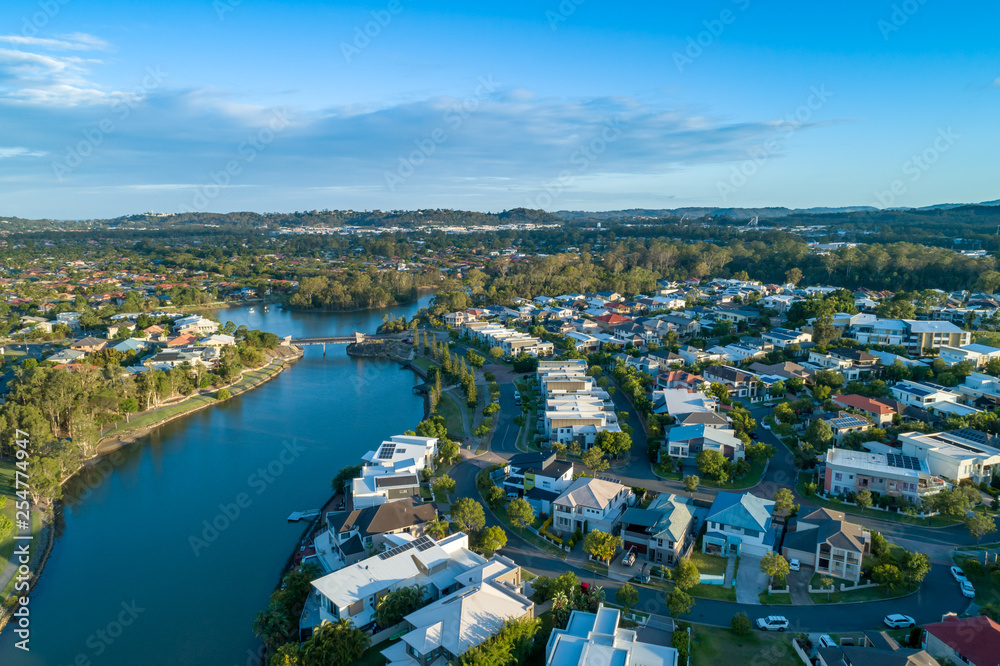 Aerial landscape of Reedy creek and luxury houses. Varsity Lakes, Gold Coast, Queensland, Australia