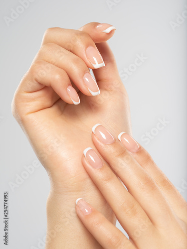  Beautiful female hands. Woman hands with beautiful french manicure, nails.