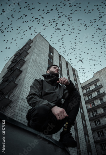 Man on the background of a high-rise building