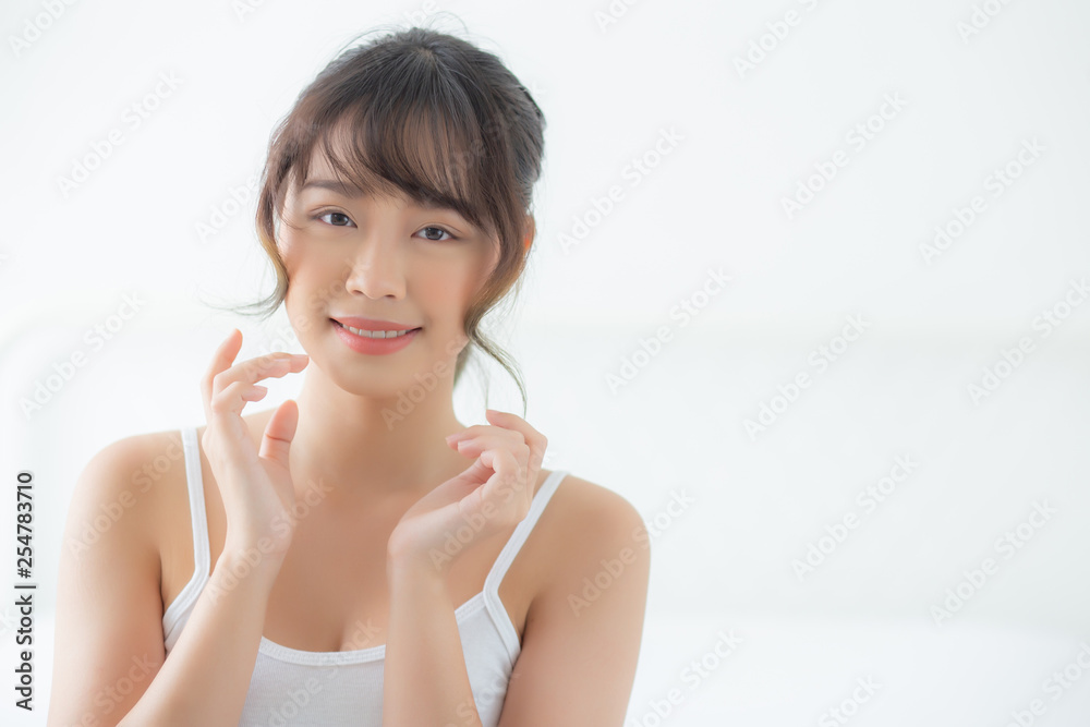 Portrait beautiful asian woman makeup of cosmetic, girl hand touch cheek and smile attractive, face beauty perfect with wellness in the bedroom with skin care and healthcare concept. Portrait beautiful asian woman makeup of cosmetic, girl hand touch cheek and smile attractive, face beauty perfect with wellness in the bedroom with skin care and healthcare concept.
