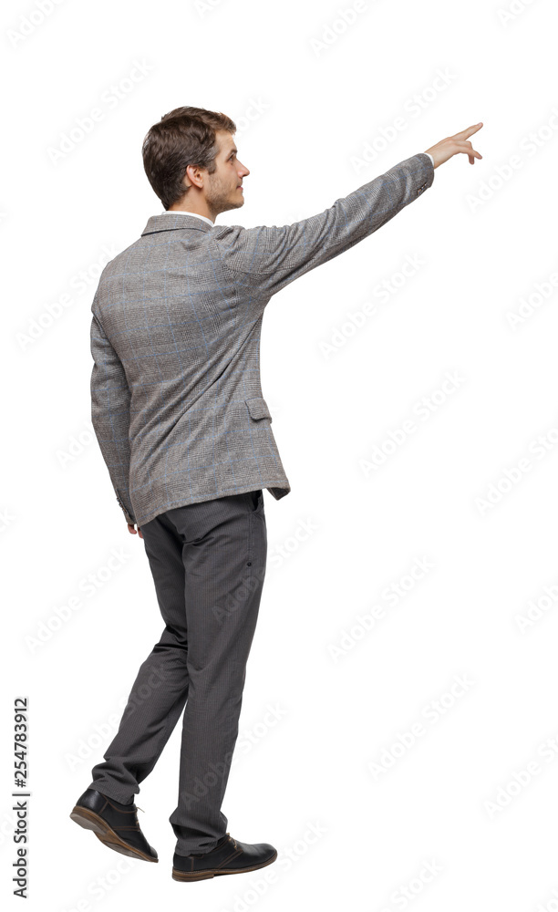 Back view of walking pointing business man. Back view of walking pointing business man.