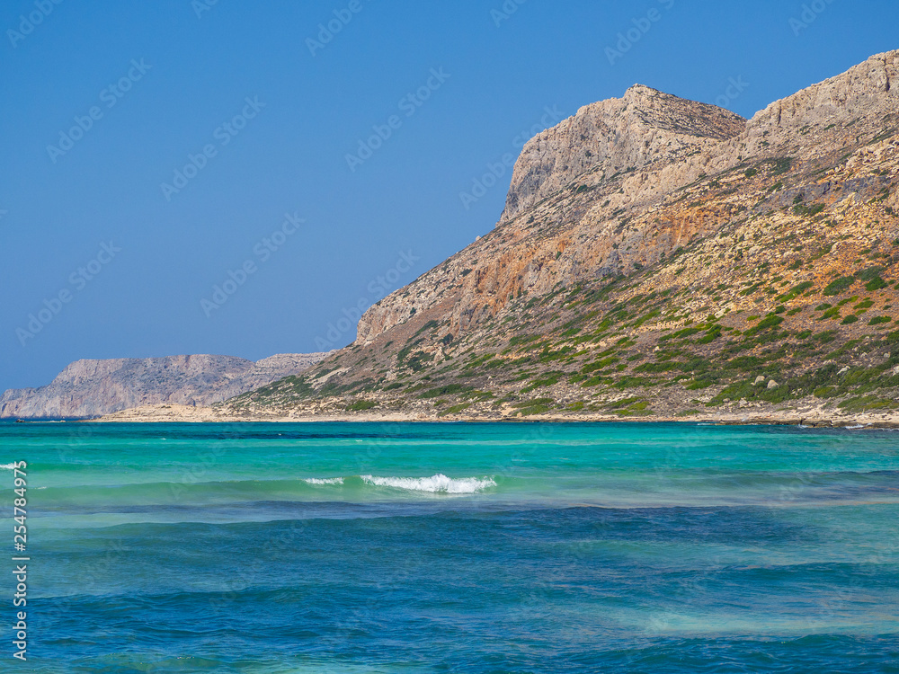 Perfect blue water and rocky hills of Crete - Greece