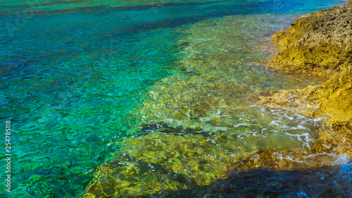 Crystal clear turquoise water and rocky seaside