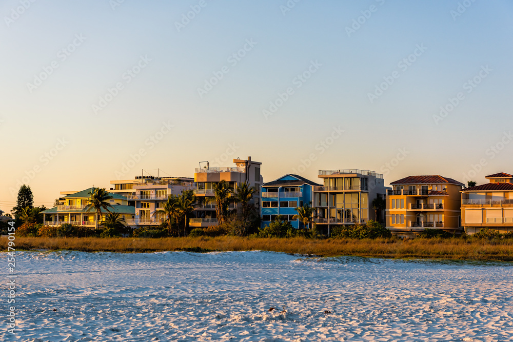 Sarasota, USA Sunset in Siesta Key, Florida with coastline coast houses holiday homes on gulf of mexico beach shore with nobody