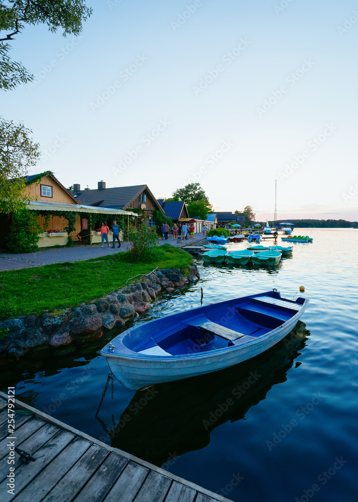 Boat on Galve Lake in Trakai at sunset